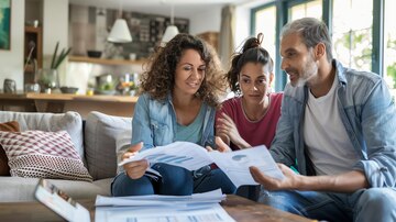 Family discussing finances together